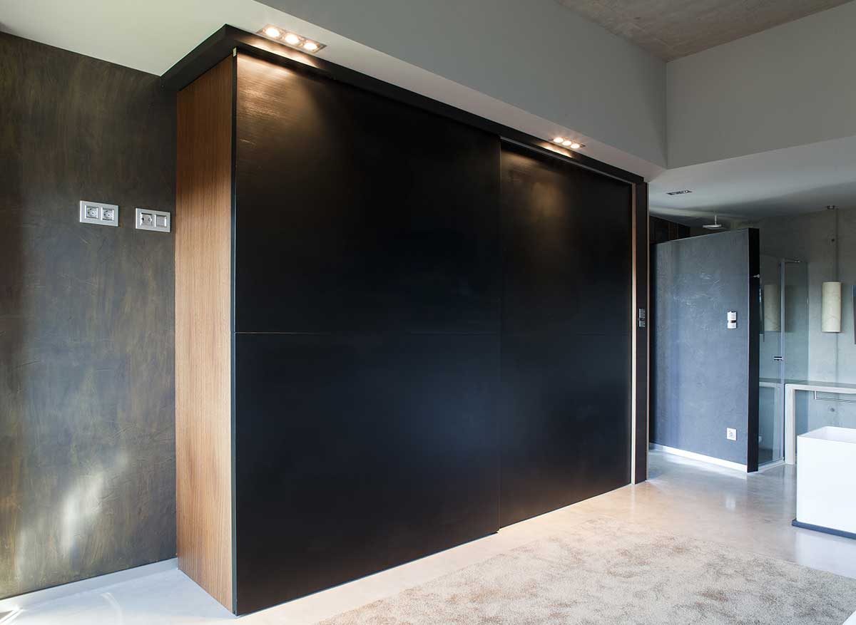 Large closets with suspended sliding doors